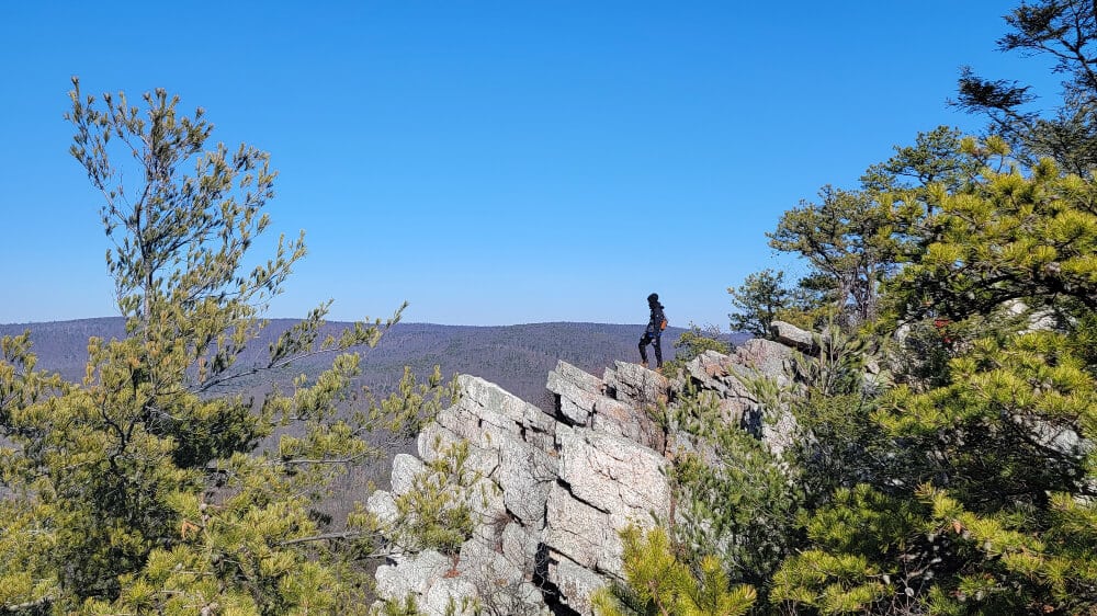 Boy stands at top of Pole Steeple trail hike near Gettsyburg