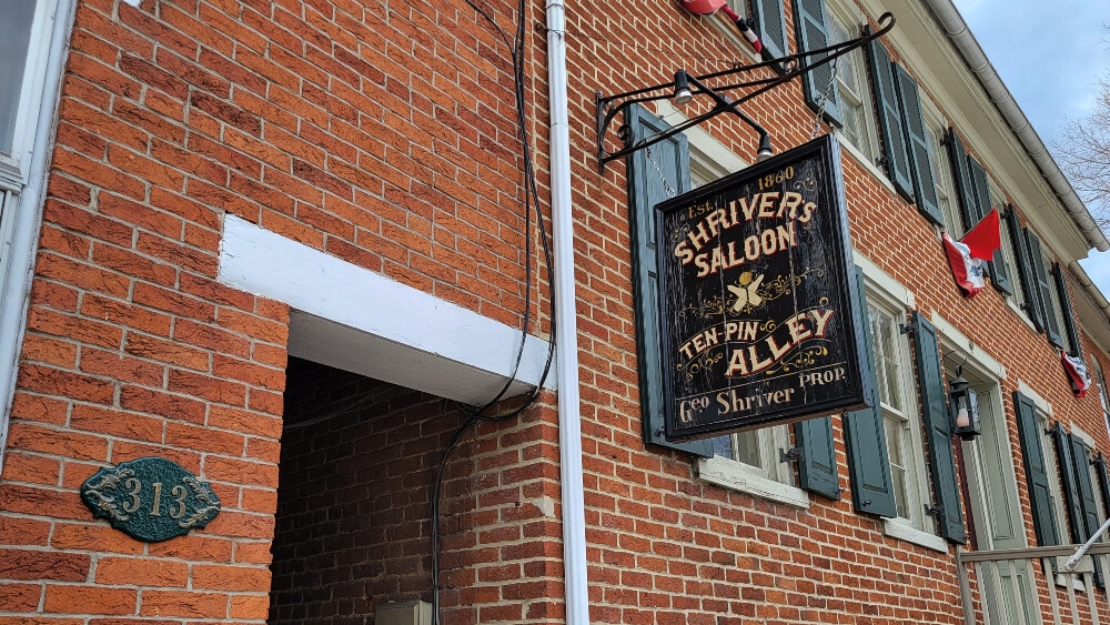 Things to do in Gettysburg with kids - the Shriver House (photo of Shriver's Saloon sign hanging above entrance)