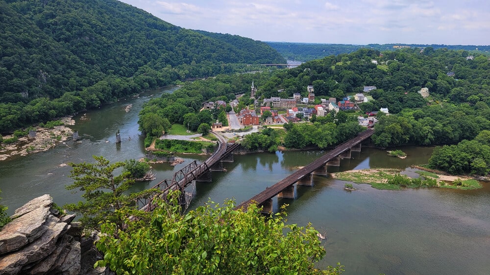 view of Harpers Ferry and two bridges from Maryland Heights Trail