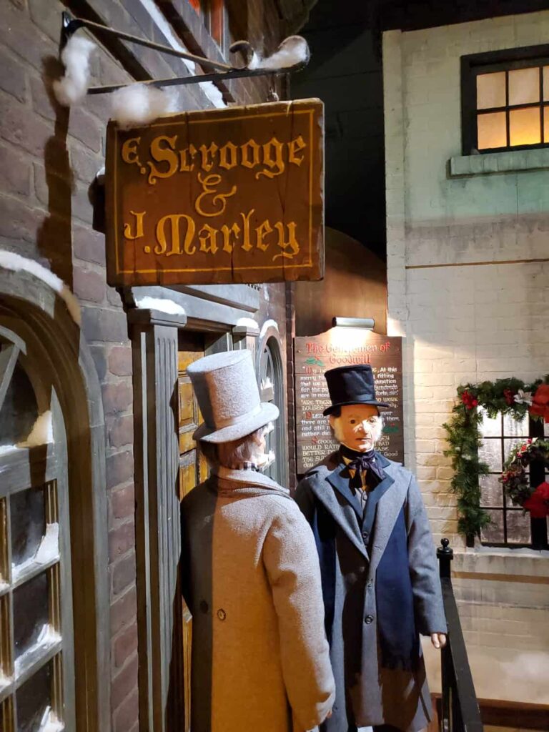 Two animatronic figures stand in front of the Scrooge & Marley counting house in the "A Christmas Carol" walk-through in Macy's Philadelphia. 