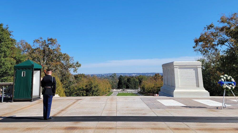 Guard stands next to the Tomb of the Unknown in Arlington National Cemetery