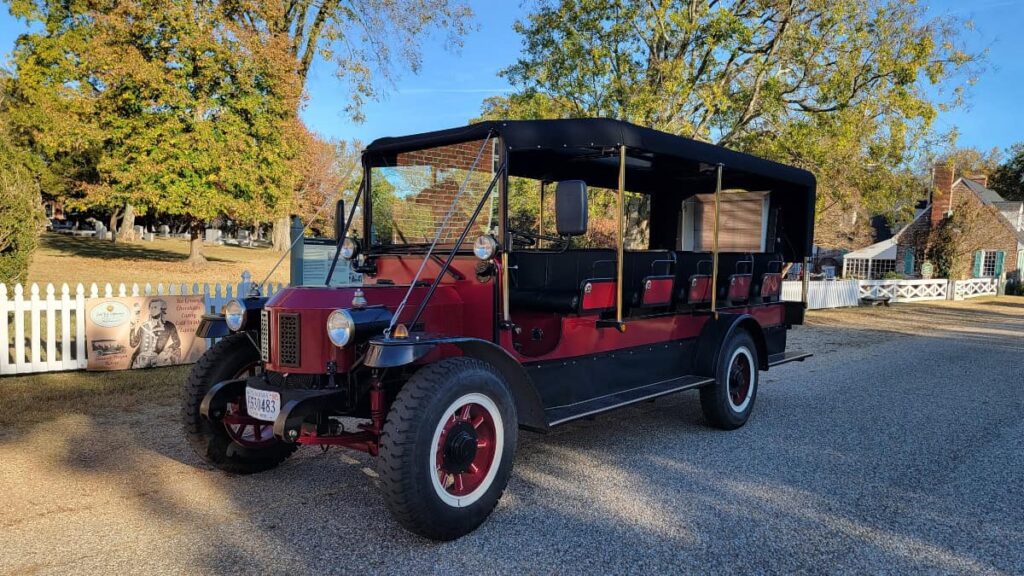 a replica steamer wagon sits on a street in Yorktown before a tour