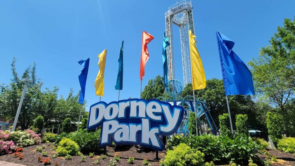 Dorney Park sign with colorful flags in the background