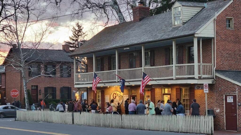 people line up in front of Mr G's ice cream in Gettysburg as the sun sets