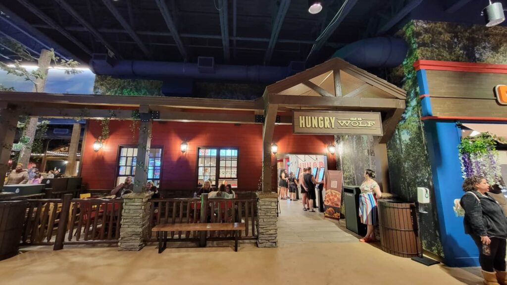 View of the outside of a pizza shop "Hungry Like a Wolf" inside a Great Wolf Lodge resort