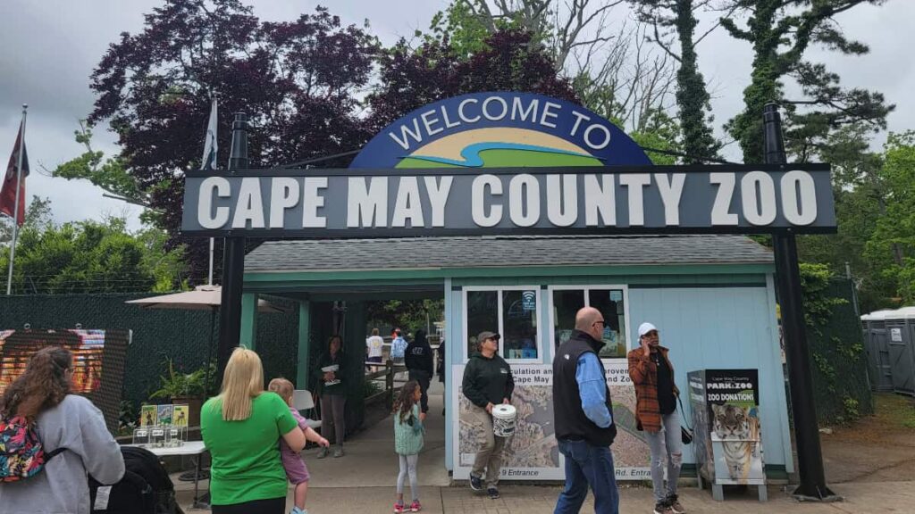 Entrance of the Cape May County Zoo with visitors entering and leaving