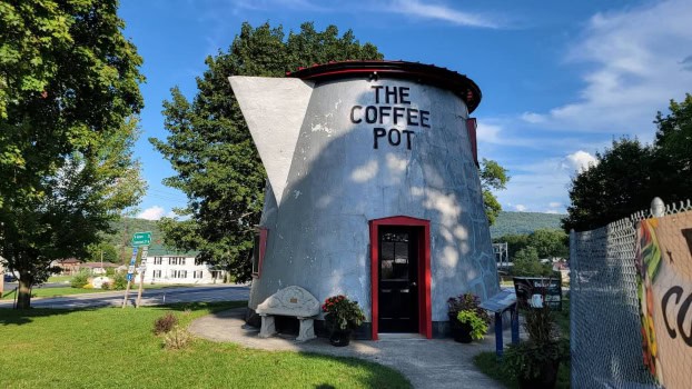 a building is shaped like a silver coffee pot