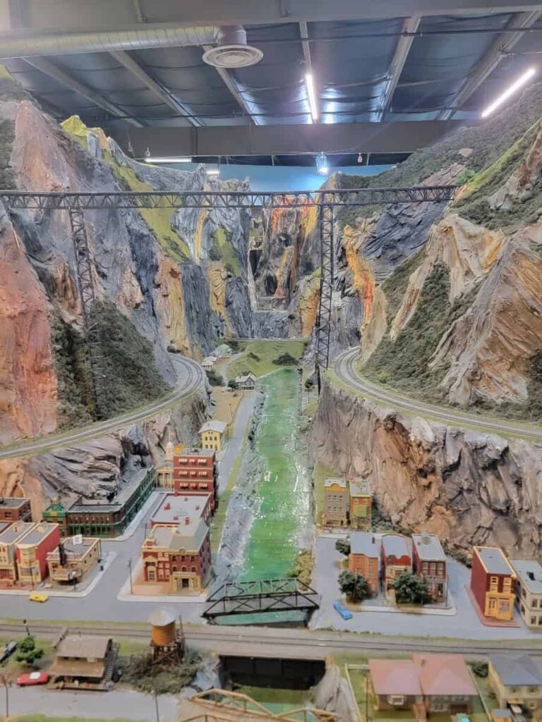 A view of a model canyon with bridges crossing and model trains below