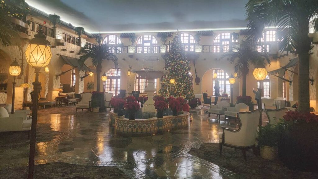 An indoor room is designed to look like a Spanish courtyard, complete with fountain.