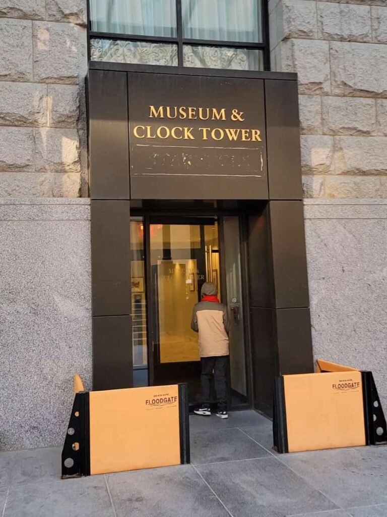 Above the entrance reads "museum and clock tower"